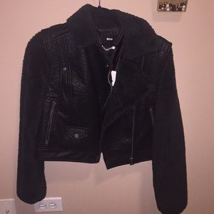 Leather jacket with fur sleeves